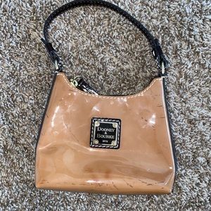 Dooney & Bourke mini light brown purse with a slight black splatter pattern